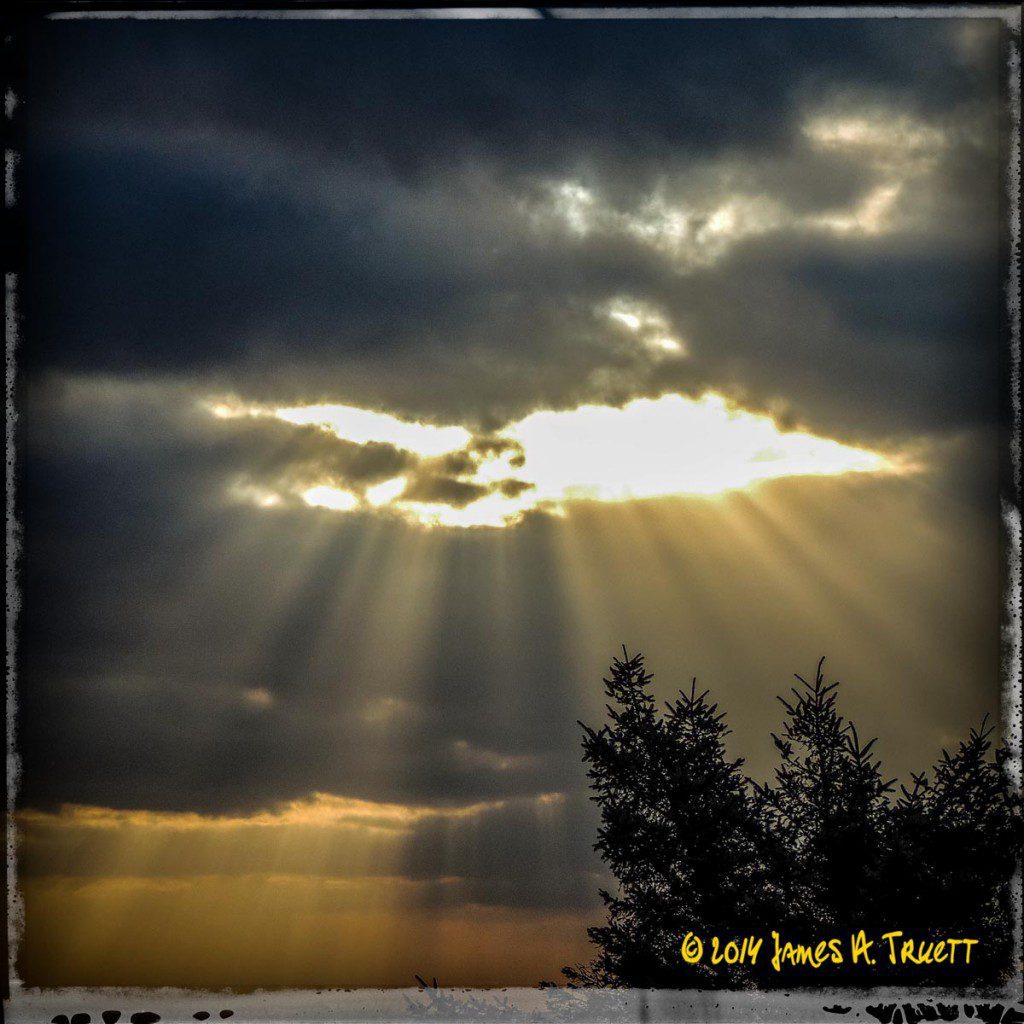 An army of sunbeams marches its way through an Irish storm.